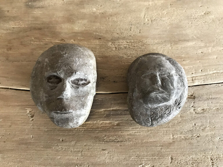 HUMAN-FACED STONES 2pc.