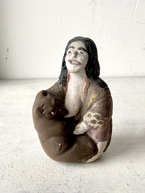 AINU WOMAN NURSING BEAR CUB